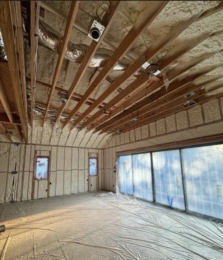 Interior walls and ceiling insulated with spray foam during new construction in Ross